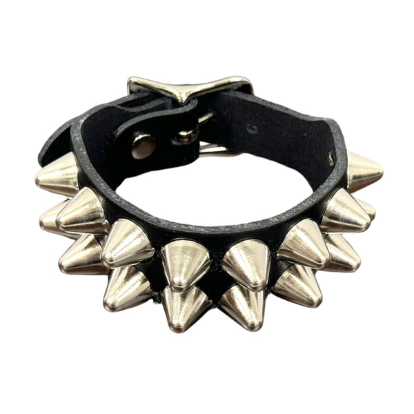 2 row English cone studded black leather cuff with silver metal buckle. Shown closed