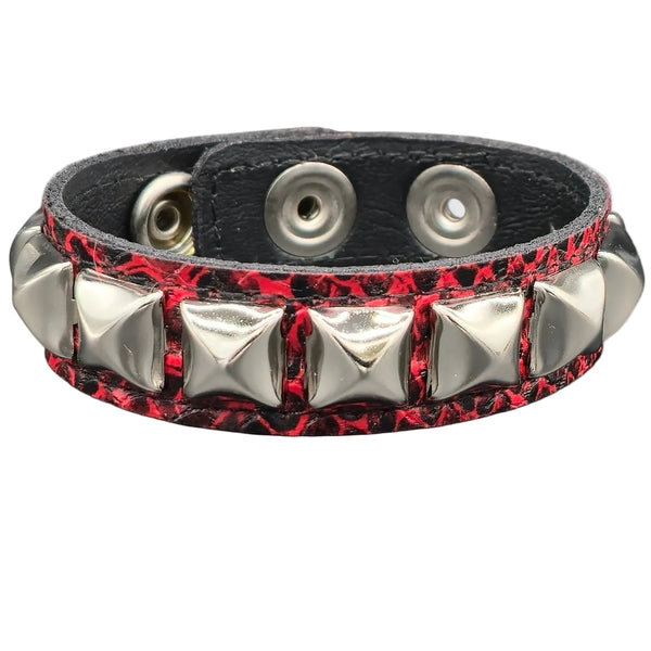 faux leather black and red textured snakeskin 1/2" wide cuff with one row of silver pyramid studs. Shown from front