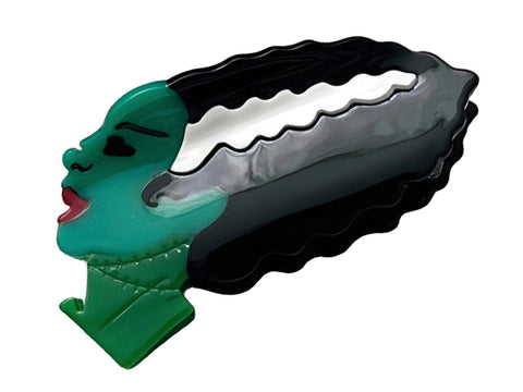 green, black, and white plastic Bride of Frankenstein head in profile hair claw clip
