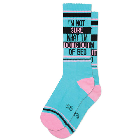 bright blue and light pink unisex crew socks with striped pink and black cuffs with message "I'm Not Sure What I'm Doing Out of Bed" in black and pink