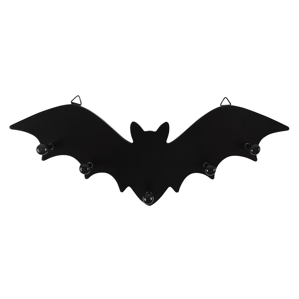 MDF bat-shaped wall mounted rack with 5 pegs and two metal loops for hanging. Shown from the front