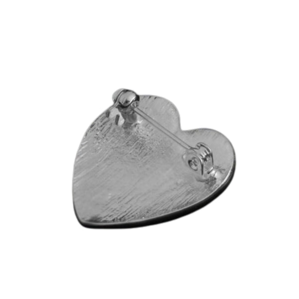 red enameled heart shaped silver metal brooch with thin silver outine shown from back on white background