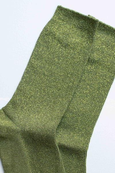 bubblegum pink lurex ribbed crew socks shown in close up of sparkly fabric