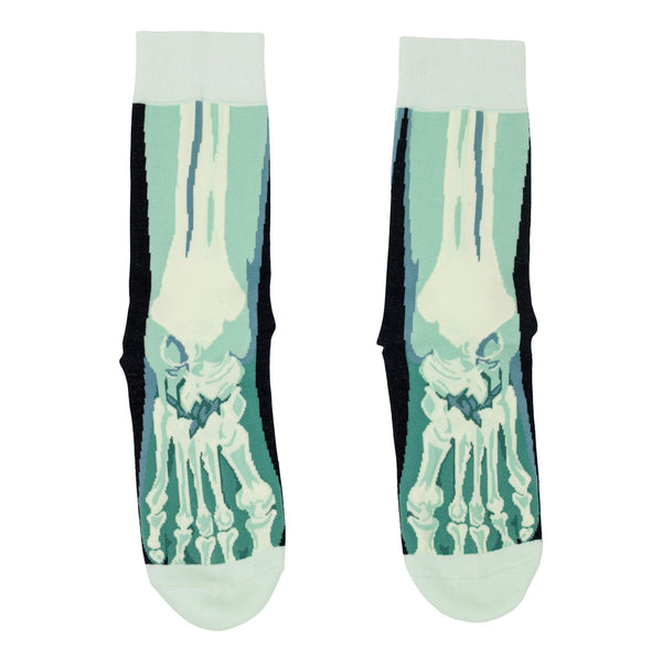 A pair of unisex cotton blend crew socks with a light blue and white x-ray style skeleton foot design, shown flat from the front