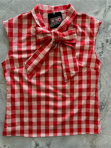 Cotton sleeveless blouse with tie neck detail in a creamy white and red plaid pattern. Shown flat 