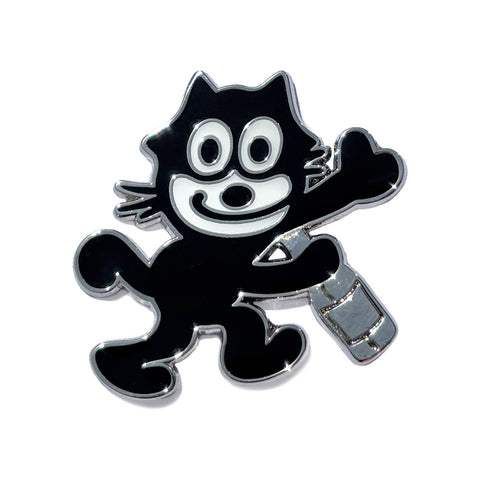 silver metal black and white enamel pin of Felix the Cat smiling and holding a bottle. Shown on white background