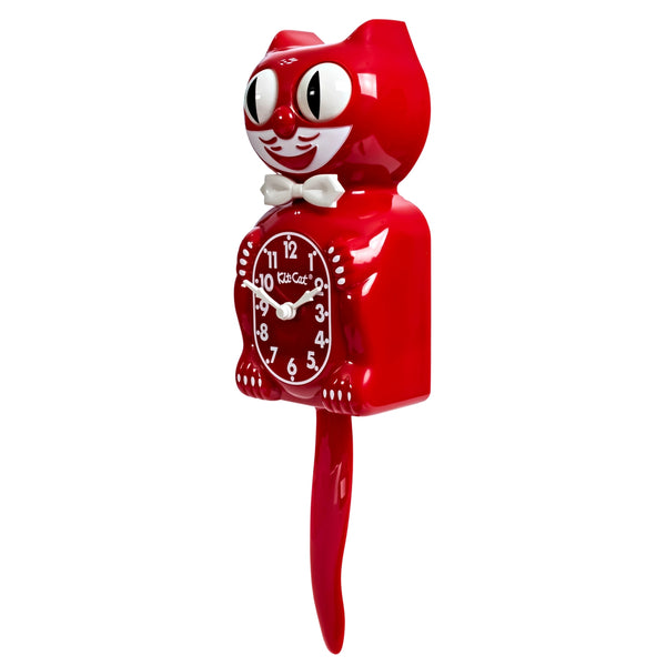 Red colored cat clock with white features and white bow tie. Shown from side at 3/4 angle