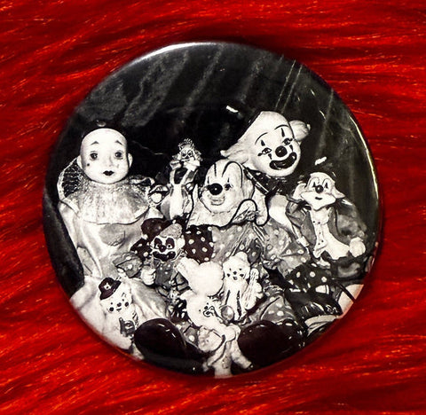 Black and white photo of a group of clowns on a 2.25" circular button against a red background
