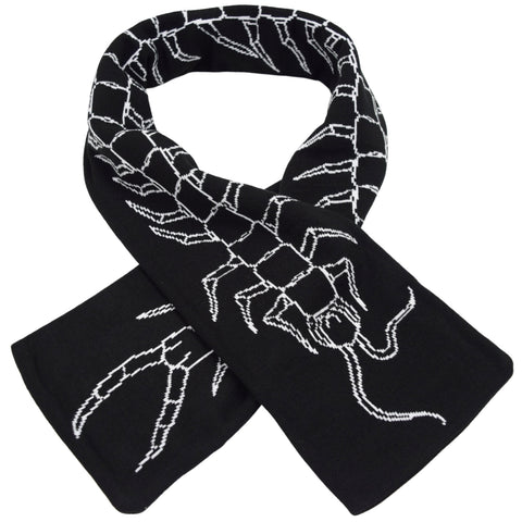 black knit scarf with jacquard knit design of centipede running the length of the scarf. Shown folded over