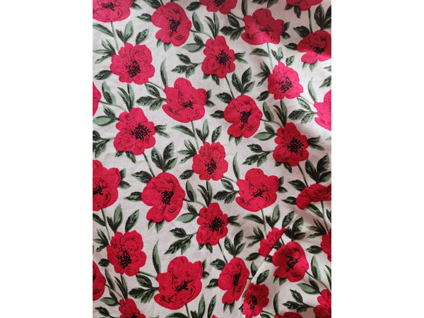  warm off-white background pattern of red and black flowers with green leaves