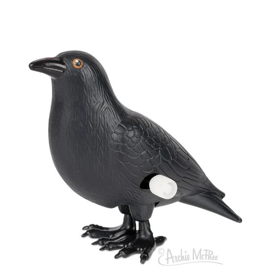 A black plastic crow toy that hops when wound up