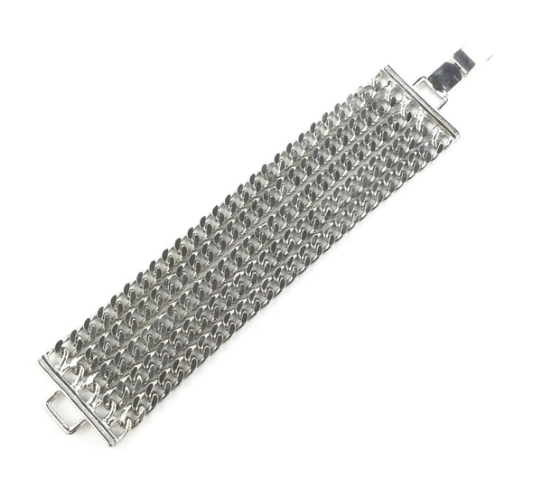 bracelet made of 5 rows of silver metal curb style chains with matching metal clasp closure. Shown flat