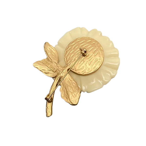 cream colored rose brooch with large enameled petals and matte gold metal stem and leaves. Shown from back