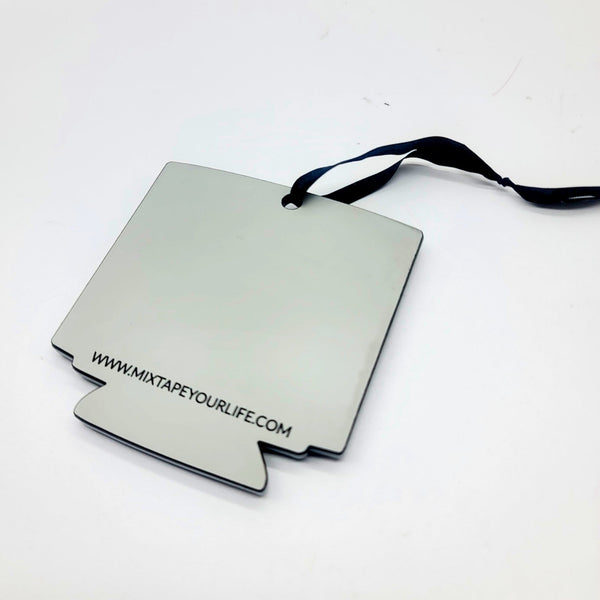 Holiday ornament made of matte grey laser cut acrylic in the shape of a PC computer monitor with domed resin screen displaying art from the Oregon Trail video game with "Get in loser, we're going to die of dysentery" message in neon green UV reactive paint. Ornament has black satin ribbon hanger. Shown flat from back with branded stamp 