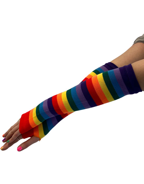 a model wearing elbow length rainbow striped knit fingerless gloves with thumb holes