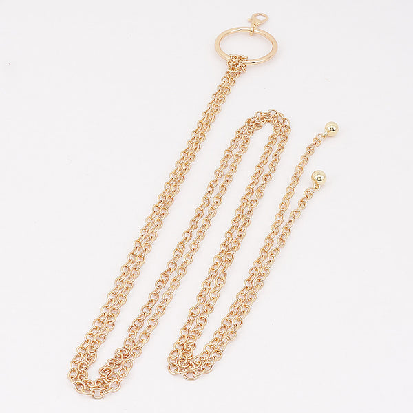 ouble link chain belt in gold with round charms at the end of each chain connected to large matching silver O ring. Shown flat