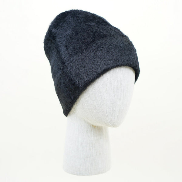 A black fuzzy faux-fur beanie style hat shown worn by mannequin head