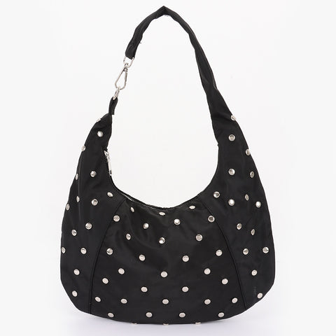 black nylon slouchy shoulder bag with silver flat round stud detail, zip closure, and asymmetrical metal clasp detail at shoulder strap. Shown from side