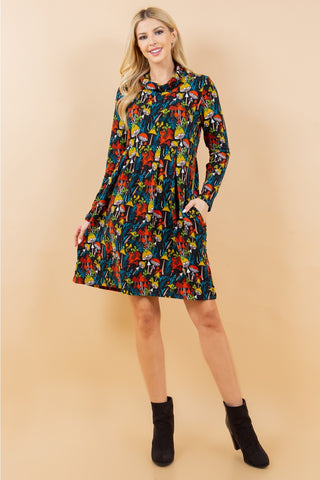 black and multicolored mushroom and forest flora print on a long sleeve fit & flare sweater dress with a cowl neck. Seen on a model