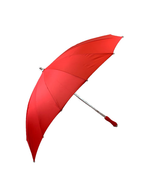 Red heart-shaped umbrella with silver metal handle and red soft foam grip. Shown open from side
