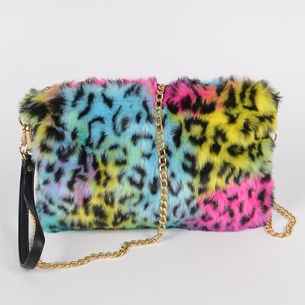 rainbow leopard print faux fur fanny pack purse with top zipper closure, gold curb chain shoulder strap, and black faux leather hand strap. Shown from front