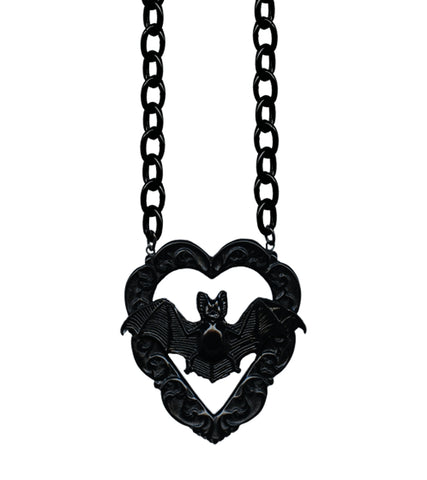 10” necklace with charm of poly resin Victorian style bat in front of ornate carved heart shaped frame. Chain of necklace is oversized black enameled metal chain. Charm shown in close up