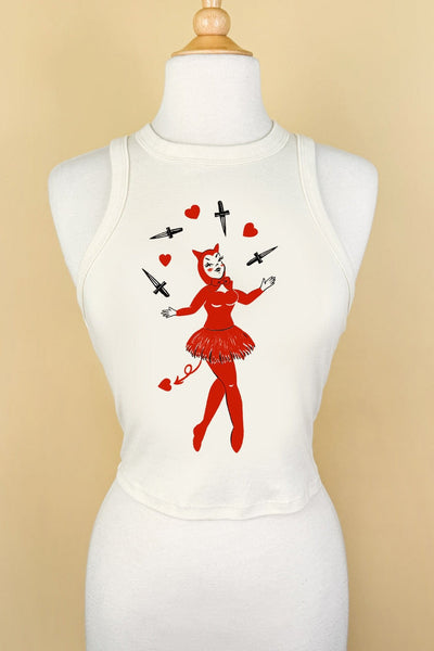 fitted off white ribbed crop tank top with round neckline and print of a pinup-style devil girl juggling black daggers and red hearts shown on a dress form