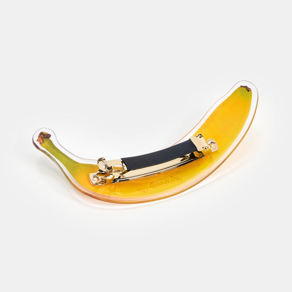 large acetate pinch clip style acetate barrette in a photorealistic yellow ripe banana design. Back of clip with hardware shown