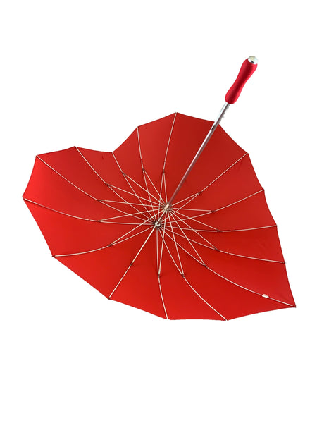 Red heart-shaped umbrella with silver metal handle and red soft foam grip. Shown open from inside 