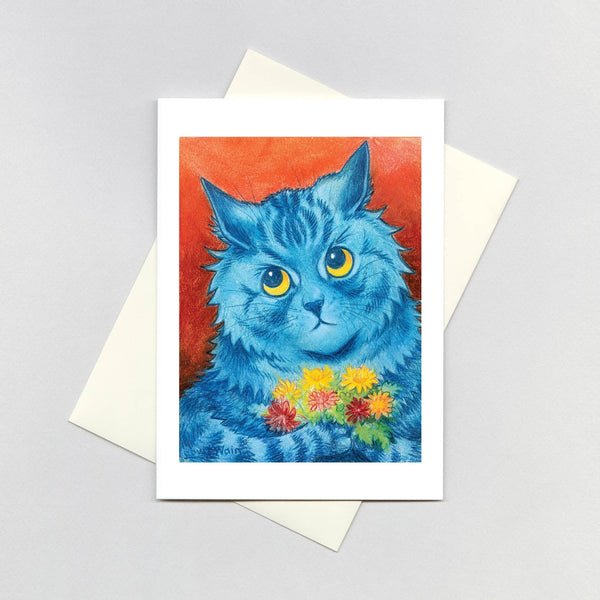 rectangular note card with colorful illustration by Louis Wain titled "A Shy Offering" of a bright blue cat on orange background holding bouquet of red and yellow flowers. Shown with envelope