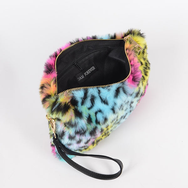 rainbow leopard print faux fur fanny pack purse with top zipper closure, gold curb chain shoulder strap, and black faux leather hand strap. Shown open from side with hand strap only