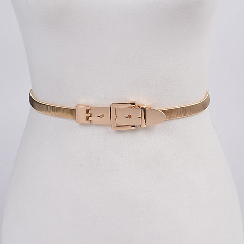 gold serpentine style stretch metal belt with matching square buckle. Shown from the front on a dress form