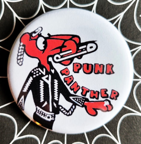 1.25” round pinback button illustration of Pink Panther wearing leather jacket and safety pins with caption “PUNK PANTHER”