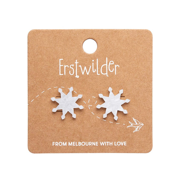 pair Essentials eight point snowflake shaped post earrings in bright white ripple texture 100% Acrylic resin, shown on illustrated round box packaging