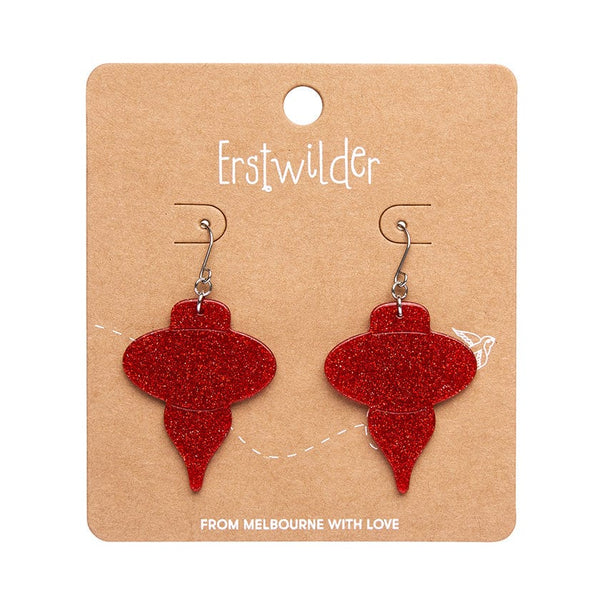 pair Essentials Collection classic holiday bauble ornament shaped dangle earrings in sparkly glitter red 100% Acrylic resin, shown on illustrated round box packaging