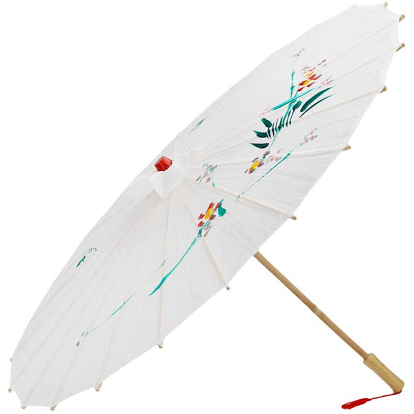 White fabric parasol with hand painted floral designs, red plastic tip, bamboo ribs and handle with red tassel on a white background. Shown open from side