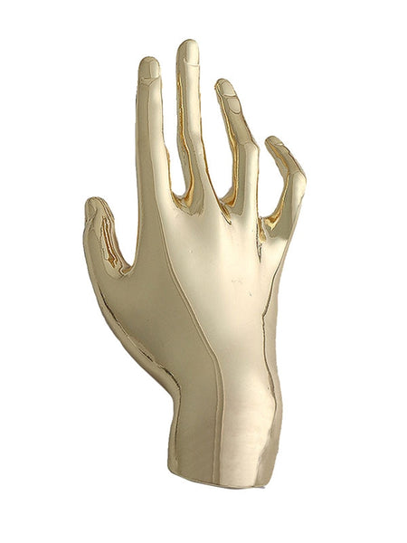 Gold metal brooch of an outstretched hand. Shown flat