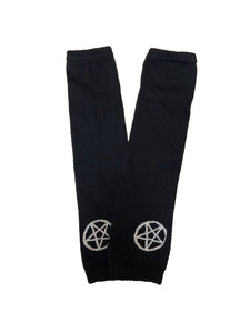 Black knit arm warmers with a white knit-in design of a pentagram on the back of each hand