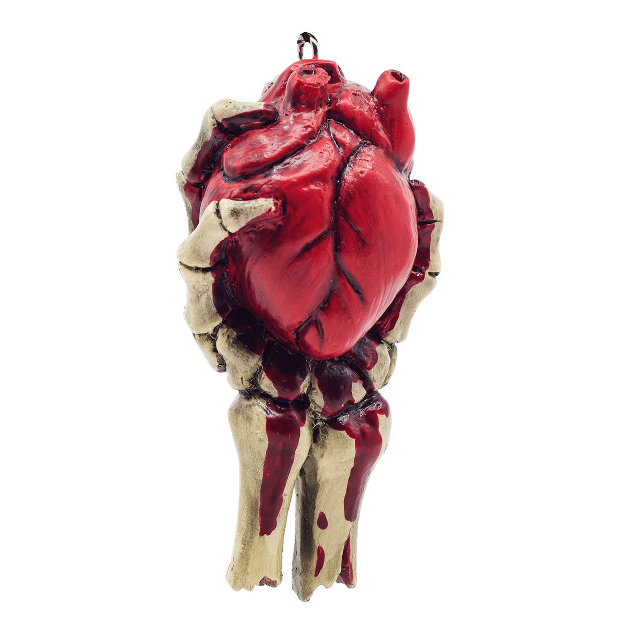 resin painted ornament in the shape of a skeleton hand holding an anatomically correct bloody heart