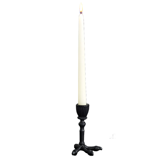 black metal with semi-gloss finish taper candleholder in the shape of a raven claw. Shown from front with lit candle