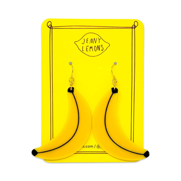 cellulose acetate dangle earrings in the shape of a pair of yellow bananas with black detail. Shown on backing card