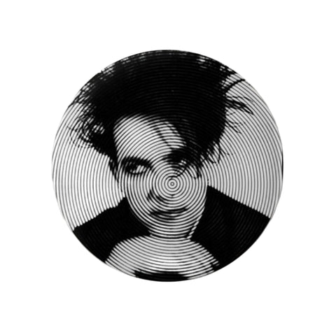 1.25” round pinback button with black and white portrait of Robert Smith on concentric circle background