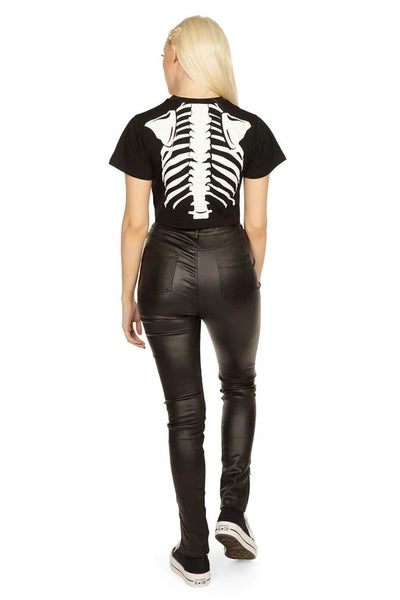Person wearing a black cropped t-shirt with a skeleton ribs design. Shown from the back