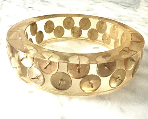 translucent resin bangle inlaid with two rows of silver metal thumbtacks