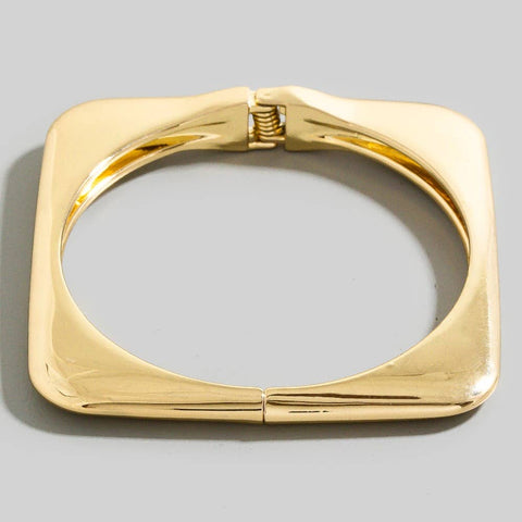 square shaped gold metal bangle with hinge closure