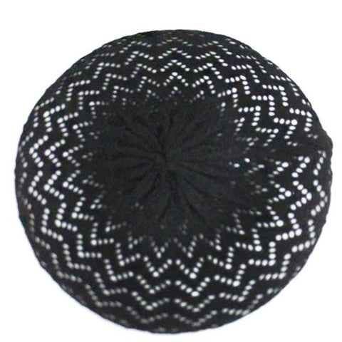 black openwork knit beret with a chevron pattern