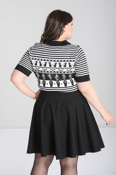 A model wearing a black and white striped short sleeve sweater with a black Peter Pan collar with keyhole and Fair Isle style pattern of black cats, hearts, skeletons, and coffins. Showing the back view