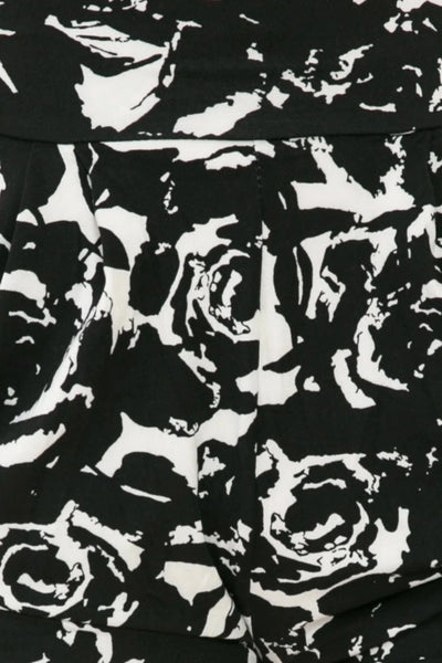 black and white floral  print brushed fiber knit relaxed fit high waist shorts with elastic waist band, pleated front, ruched side seam detail, and pockets, showing cropped close up fabric swatch