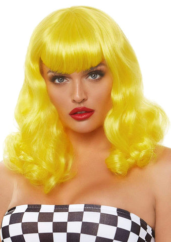 Model wearing long curly bob with bangs wig in bright yellow