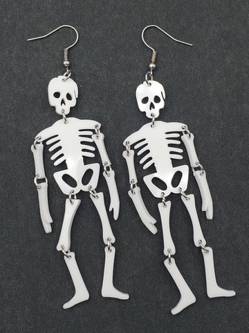 pair of white laser cut acrylic skull dangle earrings with articulated joints